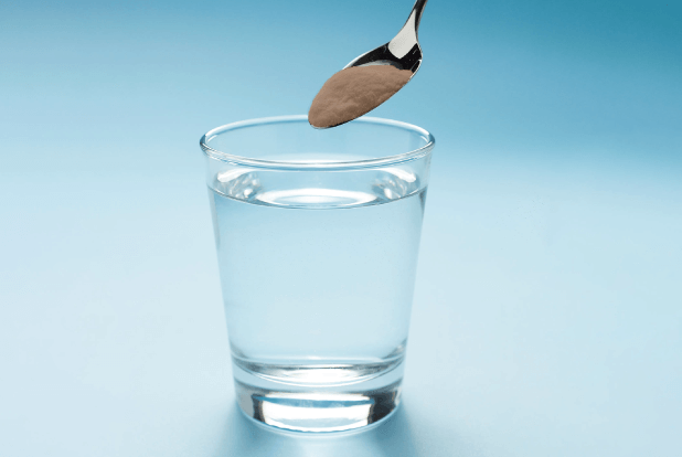 Black salt in glass of water