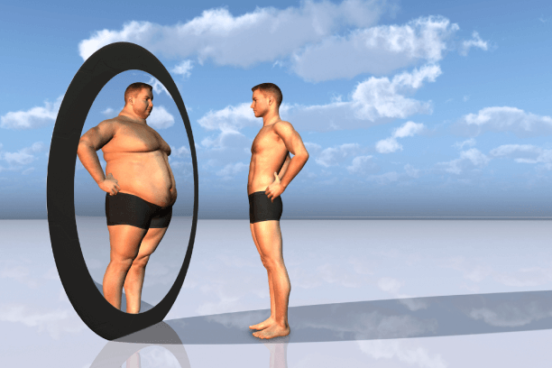 A very lean and thin person- appearing fat in mirror