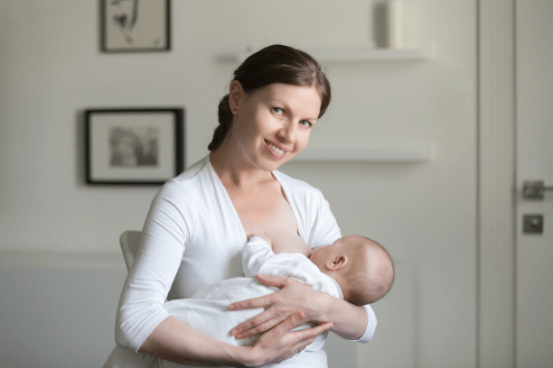 Healthy woman breastfeeding