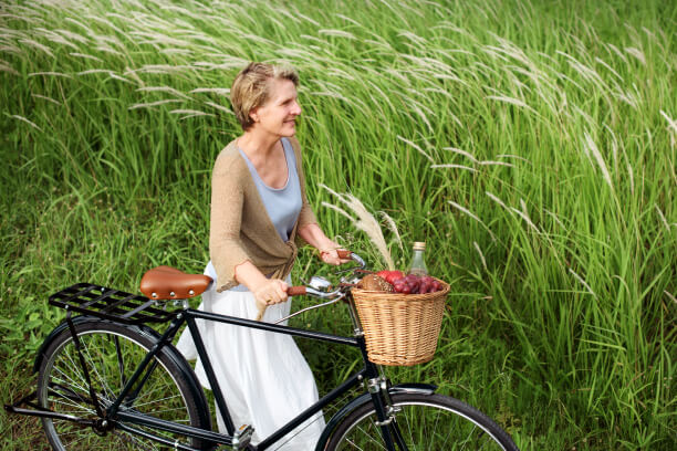 Middle-aged woman cycling Middle-aged woman cycling